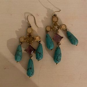 Teal and gold colored cross dangly earrings